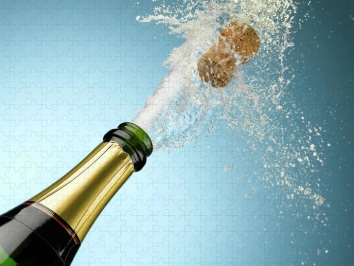 1champagneandcorkexplodingfrombottleandyroberts