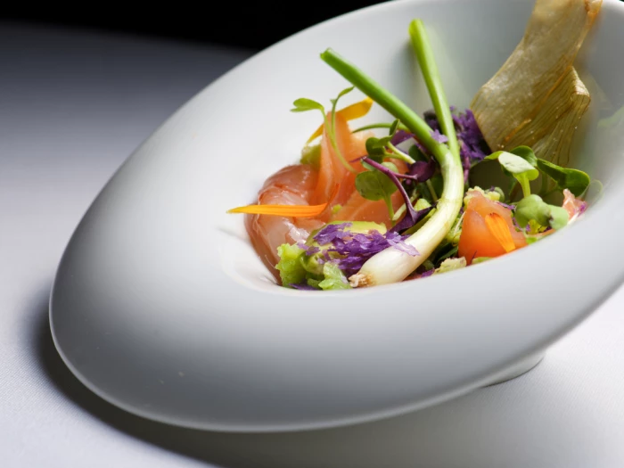 a salad starter in a white dish
