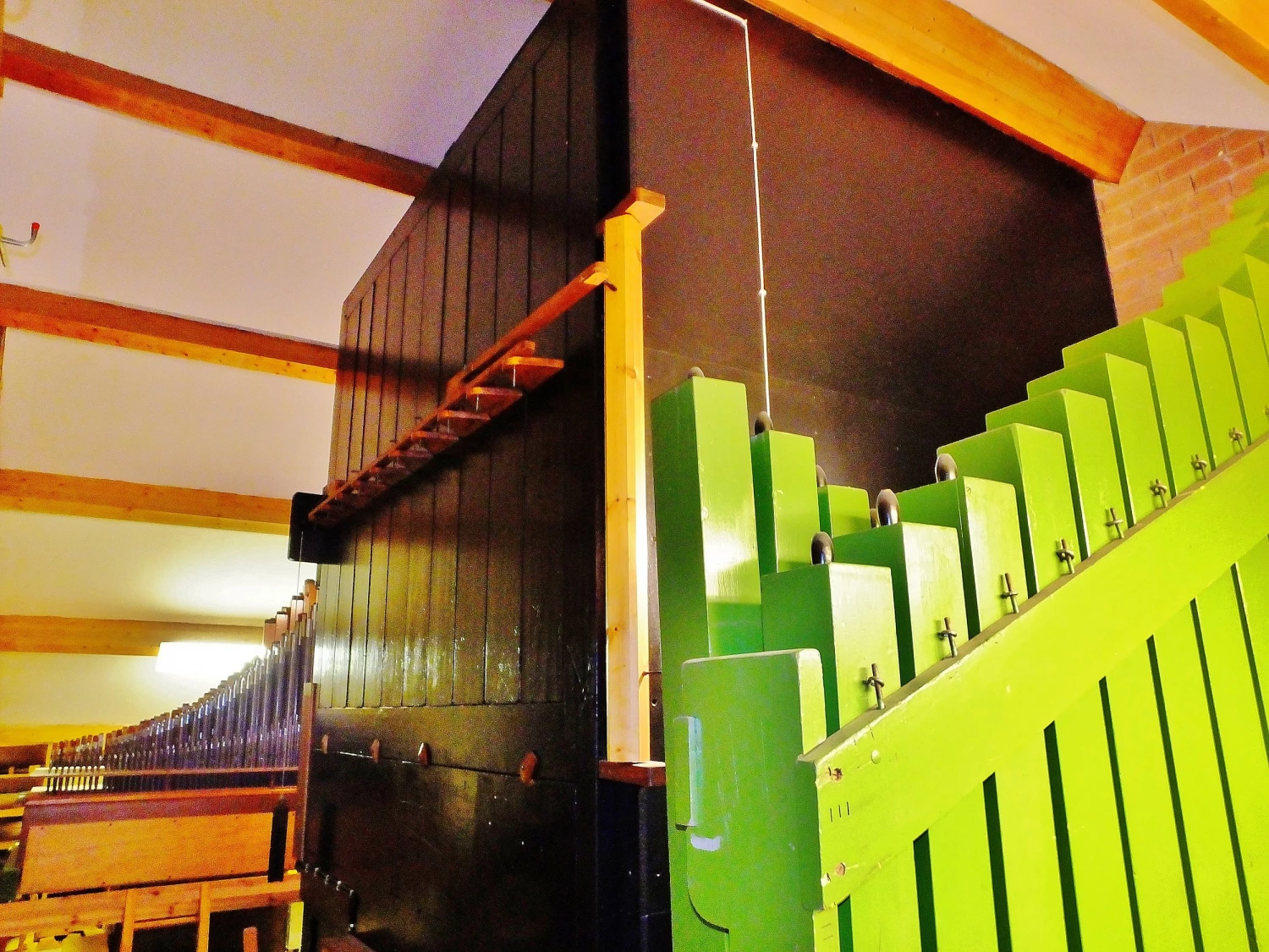 a view of the pipes in the organ loft