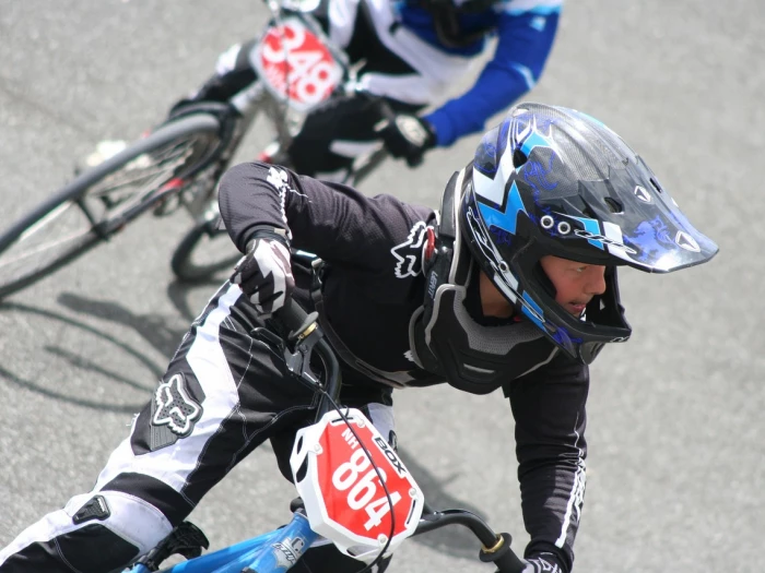 bmx riders in blue outfits