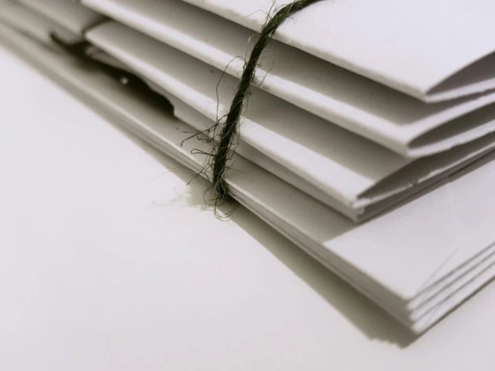 White Paper Folders With Black Tie