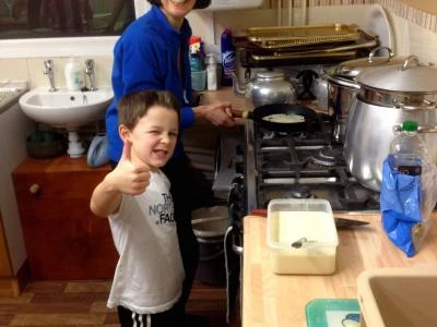 Helen and Lucas making pancakes