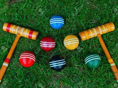 9700528-croquet-mallets-and-balls-on-grass-background-stock-photo-croquet-M175962