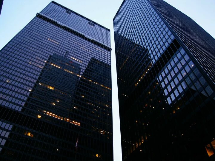 Dramatic low angle view of Toronto's skyscrapers reflecting the evening sky.