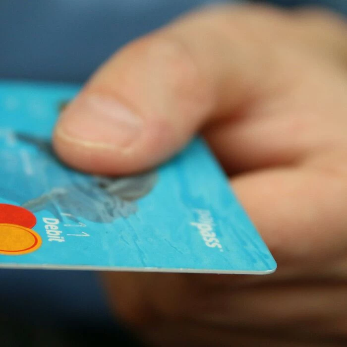 Person Holding Debit Card