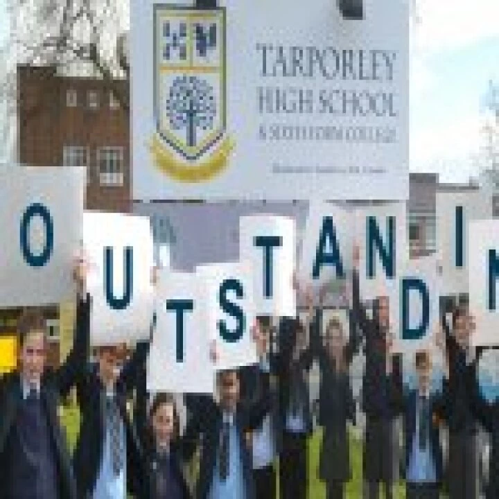 Students Holding Outstanding Letters Smaller