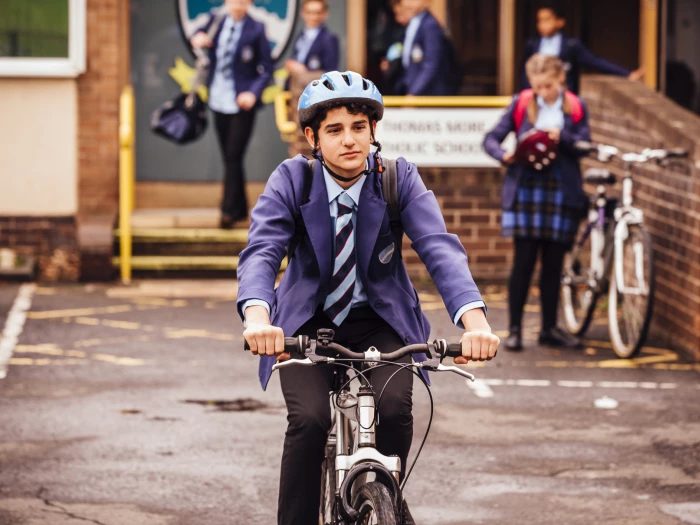 boy cycling to school