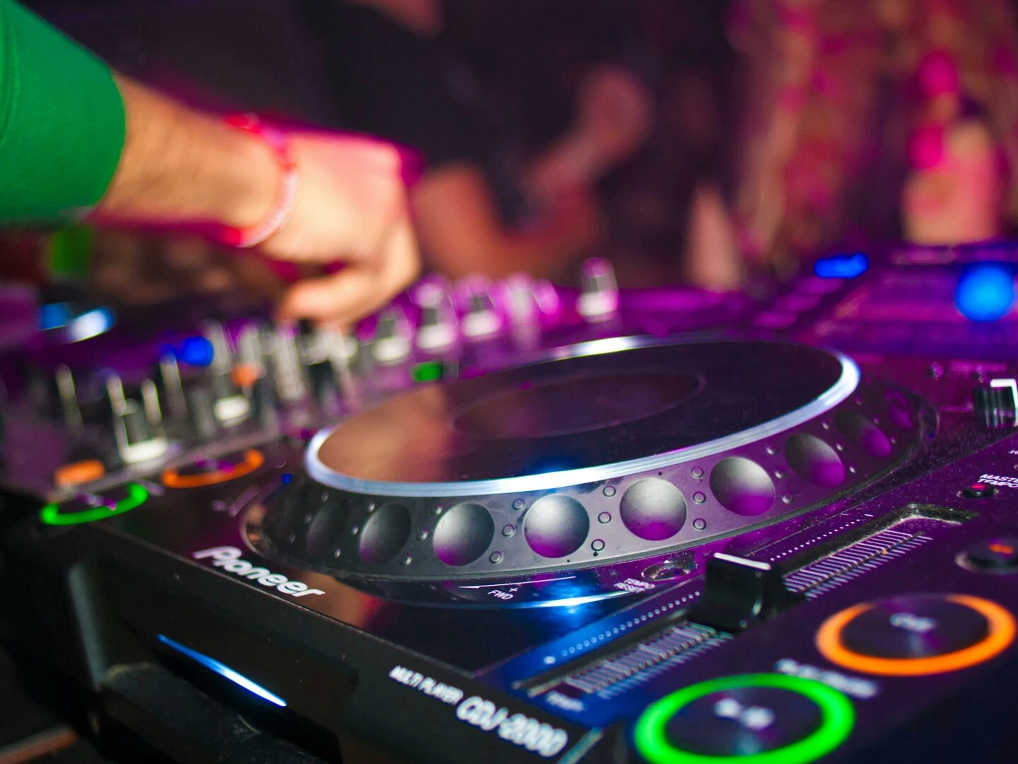 closeup of a dj39s hands on mixing console at a vibrant party in utrecht
