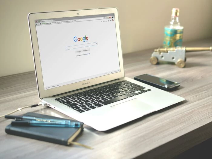 macbook air on grey wooden table