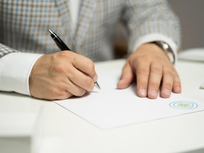 man sign paper