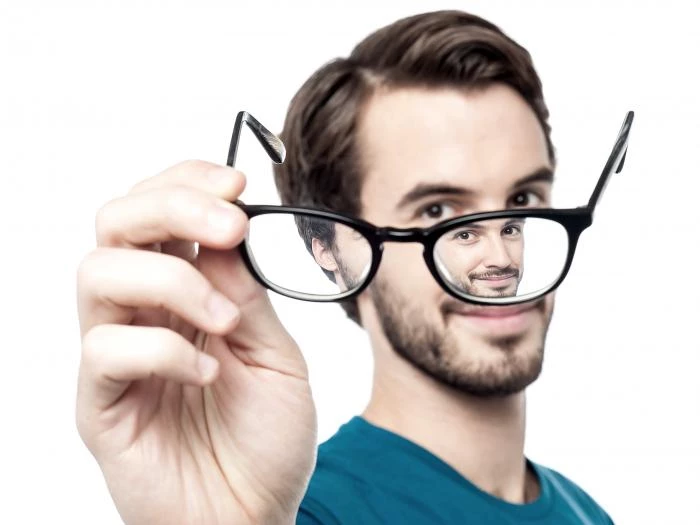 man with glasses on white background