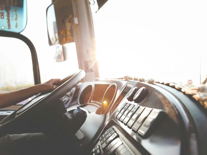 person hand on steering wheel