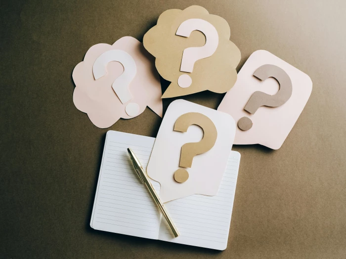 question marks on craft paper