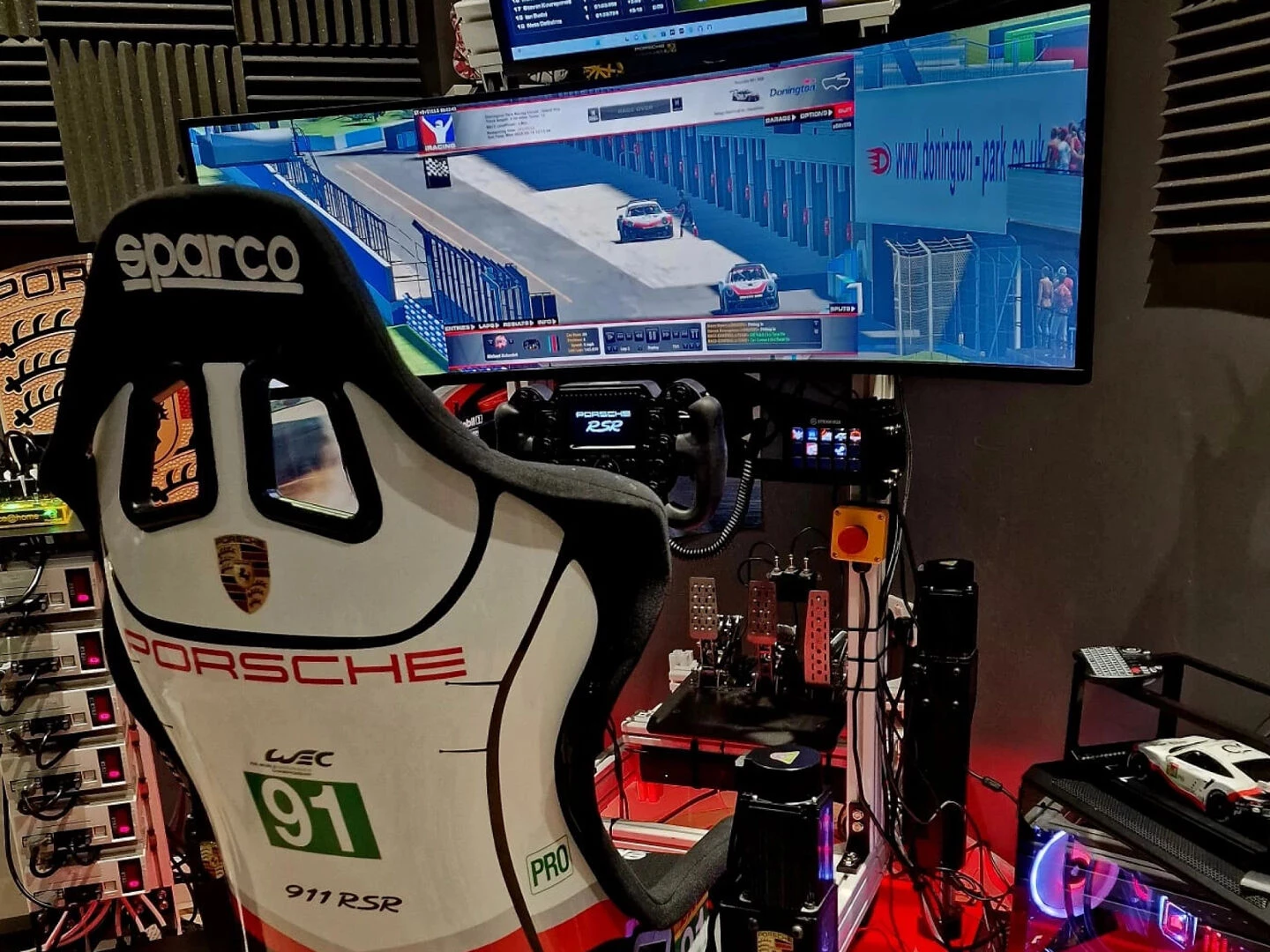 racing sim rig view from behind with a white cockpit seat