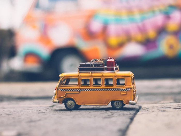 selective focus photography of yellow school bus diecast