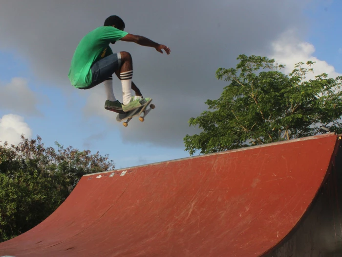 skateboarder on red vert