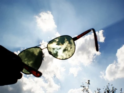 sunglasses help up to the sky