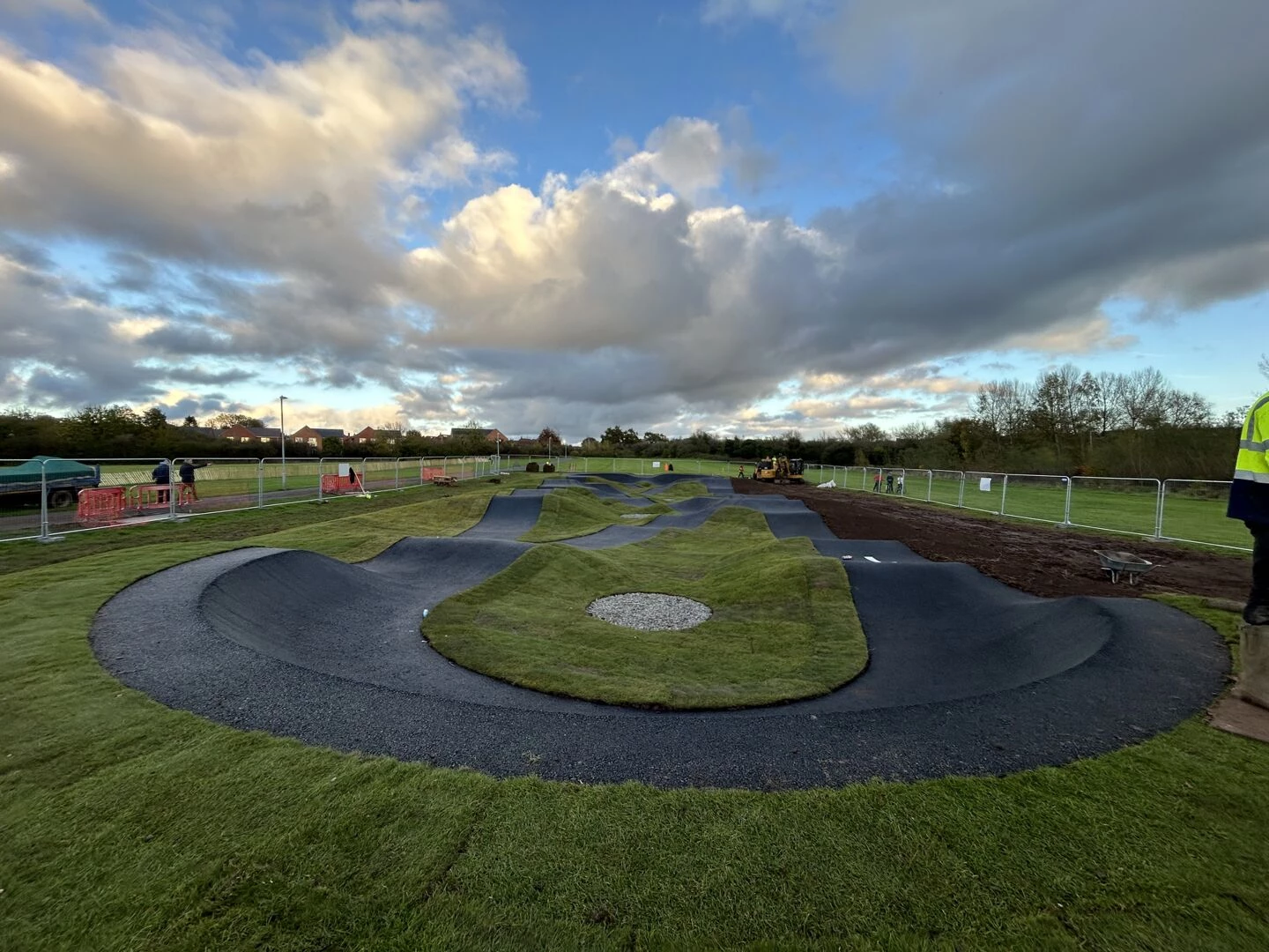 view of battenhall park pump track with dramatic sky