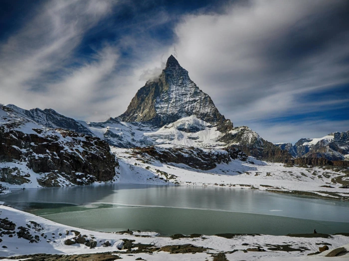white mountain under gray sky