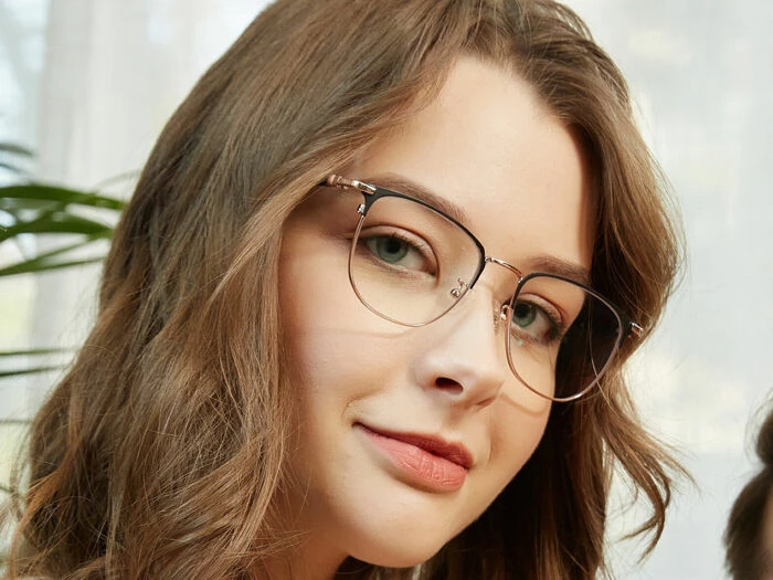 woman wearing metal frame spectacles